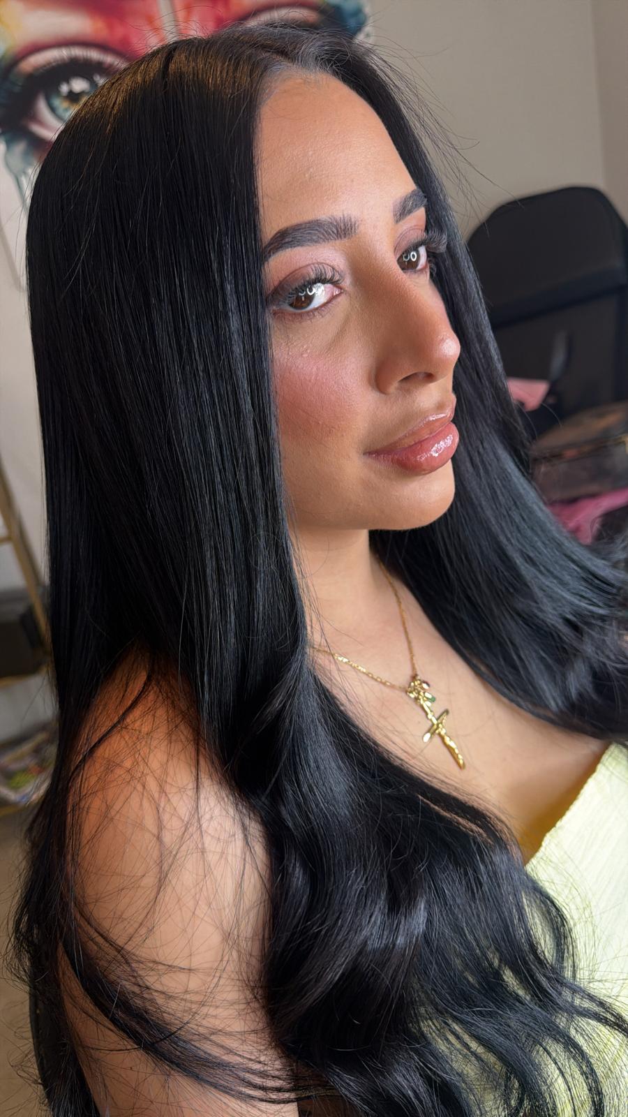 Sleek black hair and natural makeup